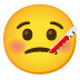 Gesicht mit Fieberthermometer