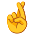 Hand mit gekreuzten Fingern
